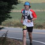 Dr. Peter Keating of Oak Harbor turns onto Sherman Road during the marathon. (Photo by Jim Waller/Whidbey News-Times)