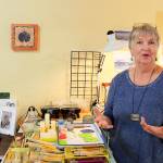 Patty Picco uses her own photographs and prints in her encaustic artwork.