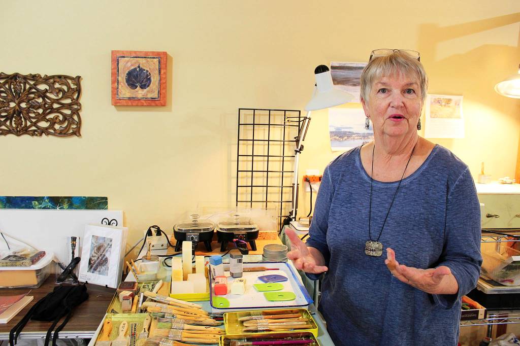 Patty Picco uses her own photographs and prints in her encaustic artwork.