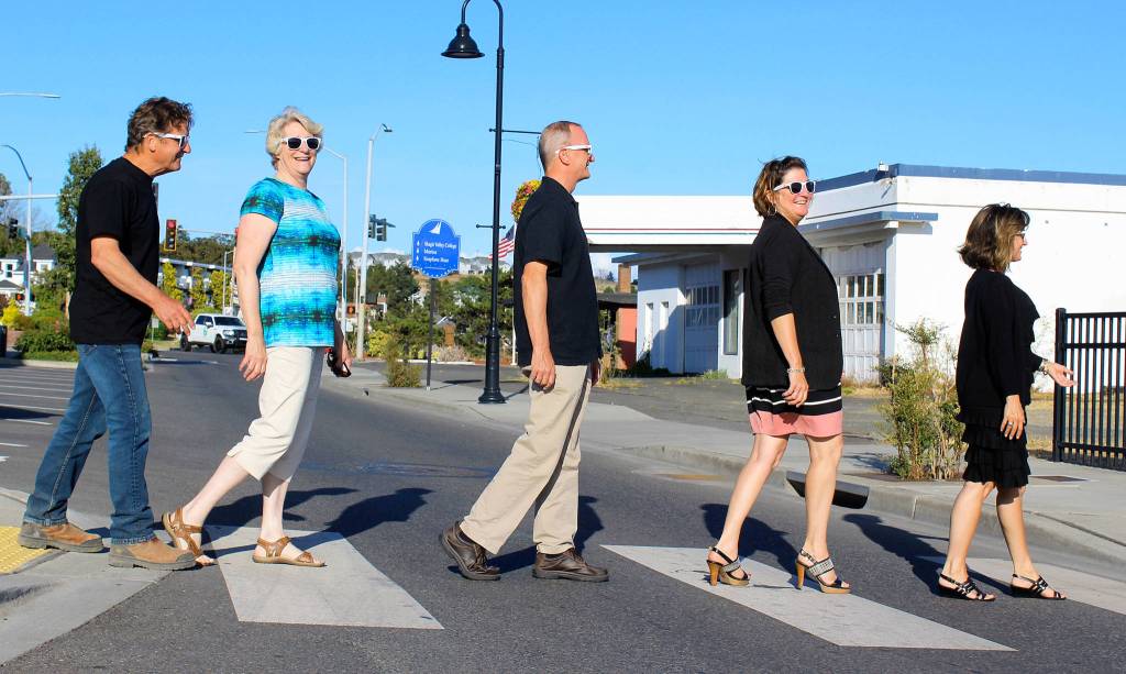 An impromptu meeting of some Oak Harbor Music Fesitval board members results in a recreation of a famous Beatles album. Walking across Pioneer Way are left to right: Larry Mason, Margaret Livermore, Gary Jandzinski, Cynthia Mason and Cheryl Jandzinski. Photo by Patricia Guthrie/Whidbey News-Times