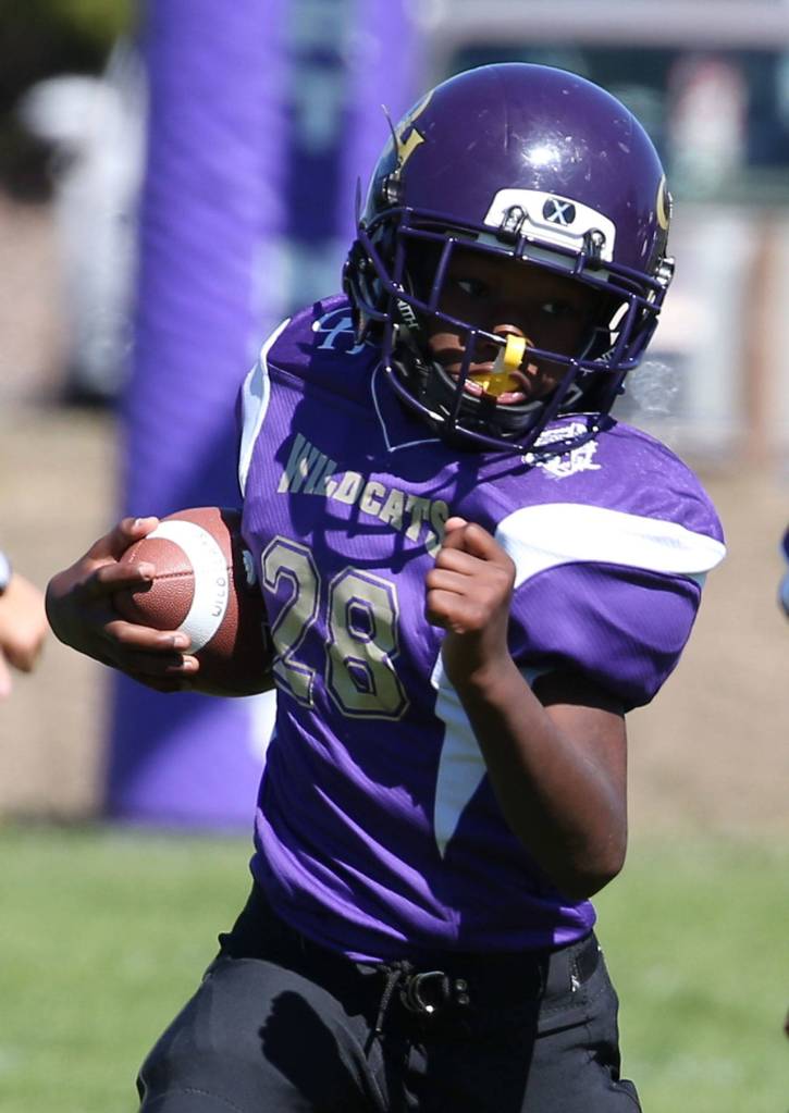 Oak Harbor Junior Gold runner Jermiah Copeland heads up field. (Photo by John Fisken)