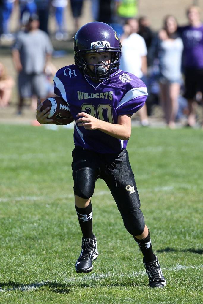 Brody Snyder heads toward the end zone in the Junior Gold game. (Photo by John Fisken)