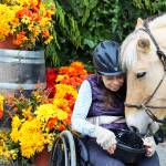 Judy Smith nuzzles with her horse after a session at Equestrian Crossings, a program providing therapeutic horsemanship. Smith travels from Seattle every Wednesday to ride with the Coupeville program.                                Photo by Patricia Guthrie/Whidbey News-Times