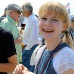 Rosahlee Van Kappel, 14, greets her friends after singing and playing ukulele Sunday morning.