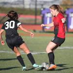 Coupeville&rsquo;s Natalie Hollrigel, right, battles for control. (Photo by John Fisken)
