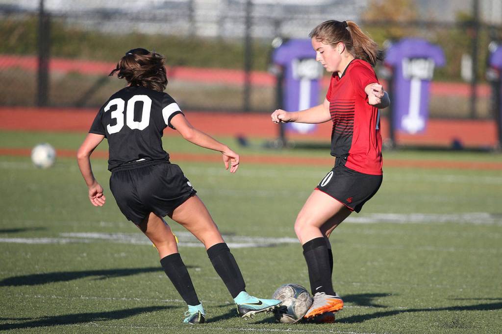 Coupeville&rsquo;s Natalie Hollrigel, right, battles for control. (Photo by John Fisken)