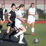 Oak Harbor&rsquo;s Danielle Lonborg looks to pass. (Photo by John Fisken)