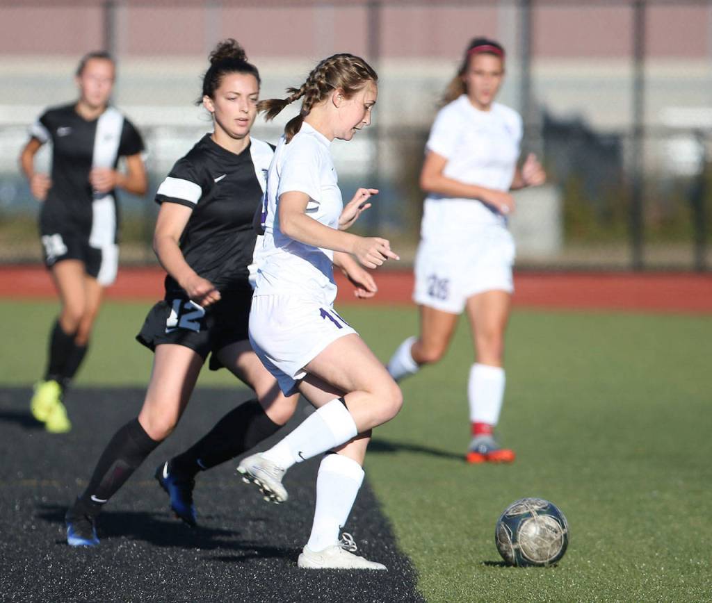 Oak Harbor&rsquo;s Danielle Lonborg looks to pass. (Photo by John Fisken)