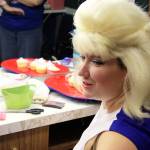 Amy Malmaker gets her big hair ready before taking the stage for Beehive.