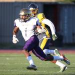 Taeson Hardin flies by a Mariner defender. (Photo by John Fisken)