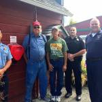 From left, lead paramedic Chris Tumblin with WhidbeyHealth-EMS, Mike Dessert and Dale Folkestad of Coupeville Festival Association, Deputy Marshal Leif Haugen of the Coupeville Marshal&rsquo;s Office and Deputy Chief Charlie Smith of Central Whidbey Island Fire and Rescue stand by one of three AEDs installed around town. Photo provided