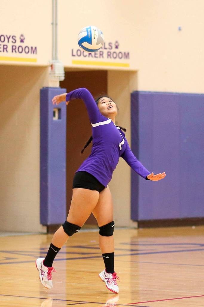 Oak Harbor&rsquo;s Sherilyne Fernandez serves Saturday. (Photo by John Fisken)