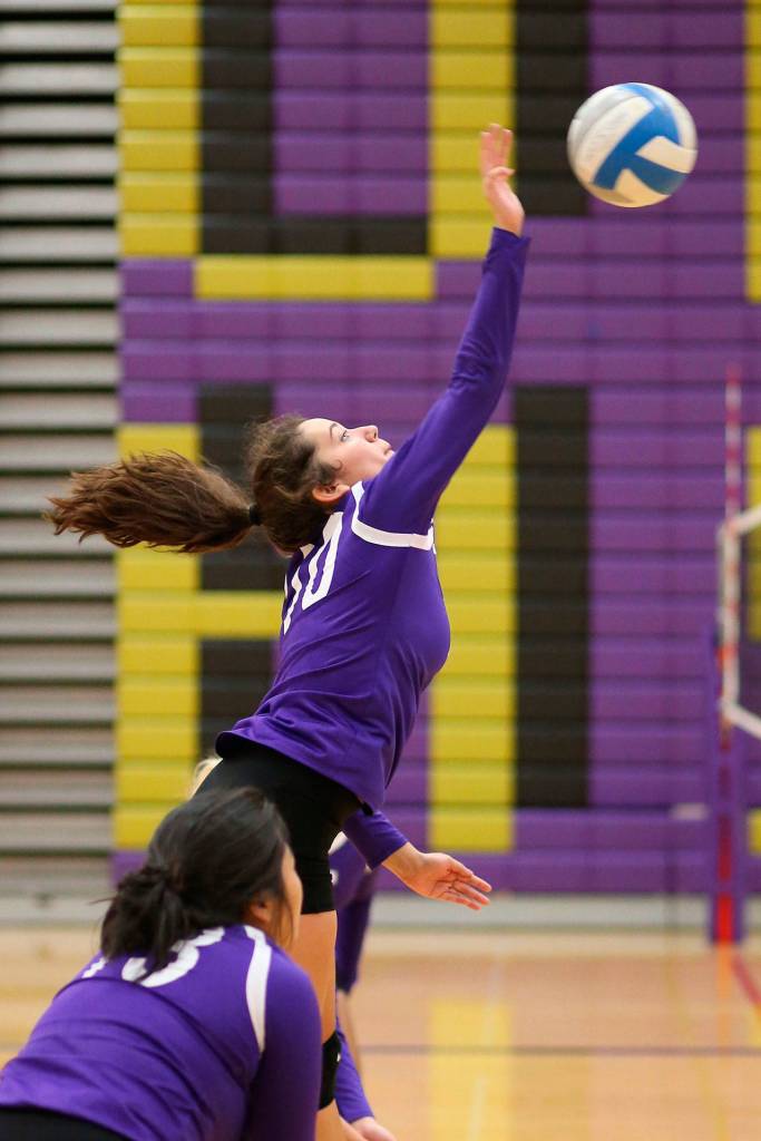 Kristina Tirado goes for a kill for the Wildcats. (Photo by John Fisken)