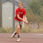 Jakobi Baumann strokes a backhand in the second singles match. (Phboto by John Fisken)