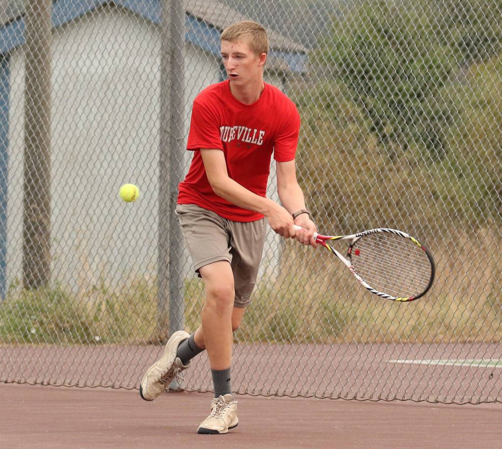 Jakobi Baumann strokes a backhand in the second singles match. (Phboto by John Fisken)