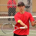 Joey Lippo returns a shot in first doubles. (Phboto by John Fisken)