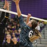 Samantha Hines tips for a point for the Wildcats. (Photo by John Fisken)