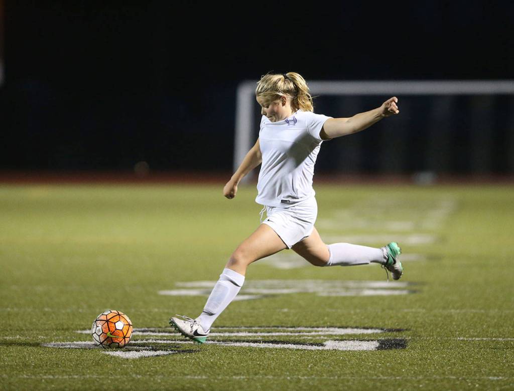 Caylie Etherington scores for Oak Harbor Thursday. (Photo by John Fisken)