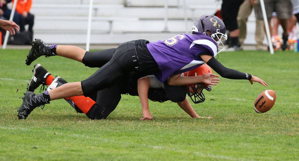 Mateo Toledo recovers a Granite Falls&rsquo; fumble in the Senior game. (Photo by John Fisken)