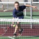 Mason Grove hustles to the ball in his second doubles win with partner Nick Etzell. (Photo by John Fisken)