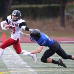 Cameron Toomey-Stout breaks a tackle on the way to a long touchdown reception against Bellevue Christian last season. (Photo by John Fisken)