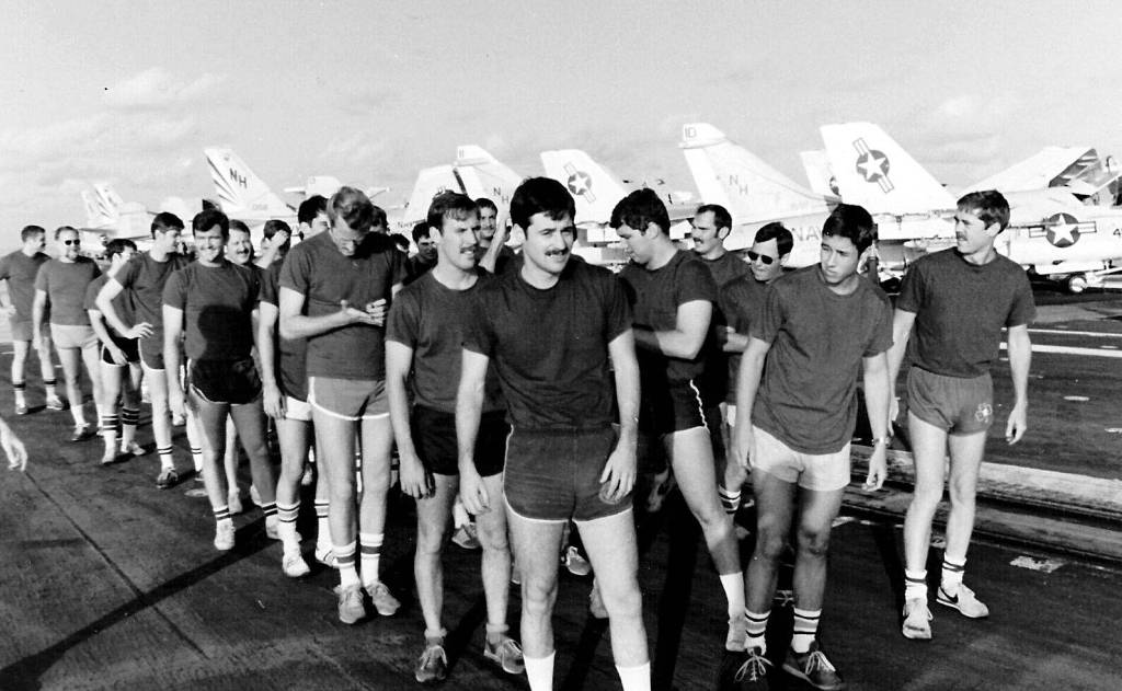 Officers assigned to VA-95, renamed the Green Lizards, in 1982, gather on tarmac at Ault Field.