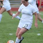 Lily Zustiak kicks the ball ahead for Coupeville in Monday&rsquo;s match. (Photo by John Fisken)