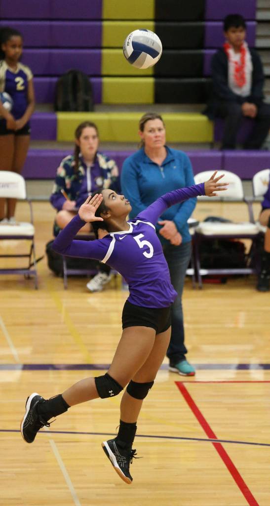 Wildcat Jaslin Webster fires a jump serve against Stanwood. (Photo by John Fisken)