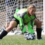 North Whidbey goalie Payton Parks scoops up a Stanwood shot. (Photo by John Fisken)