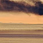 Photo by Rudy Deck                                A yacht caught fire off the west side of Whidbey Island Thursday evening. The sole occupant was able to escape in a dingy.