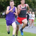 Oak Harbor&rsquo;s Micah Franklin, left, battles Stanwood&rsquo;s Garrett Larson as they near the finish line. (Photo by John Fisken)