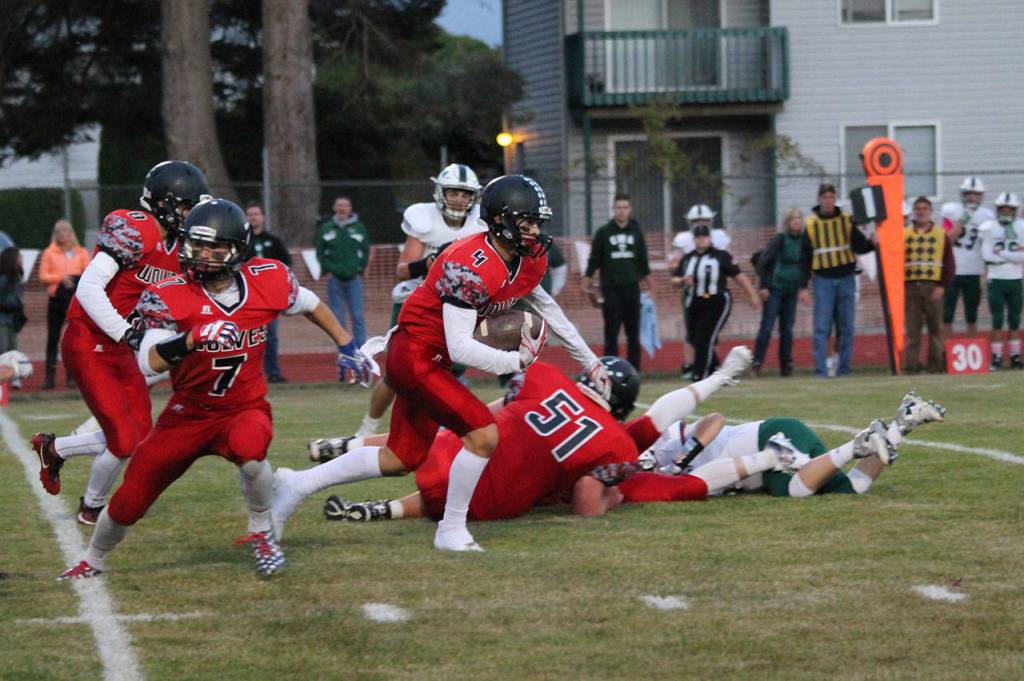 Hunter Smith flies up field after an interception. The pick set a new school career interception record. (Photo by Jim Waller/Whidbey News-Times)