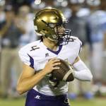 Oak Harbor QB Jordan Bell looks for an open receiver Friday. (Photo by John Fisken)