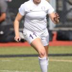 Caylie Etherington, who scored one of the Wildcats&rsquo; two goals in the match, advances the ball for Oak Harbor. (Photo by John Fisken)