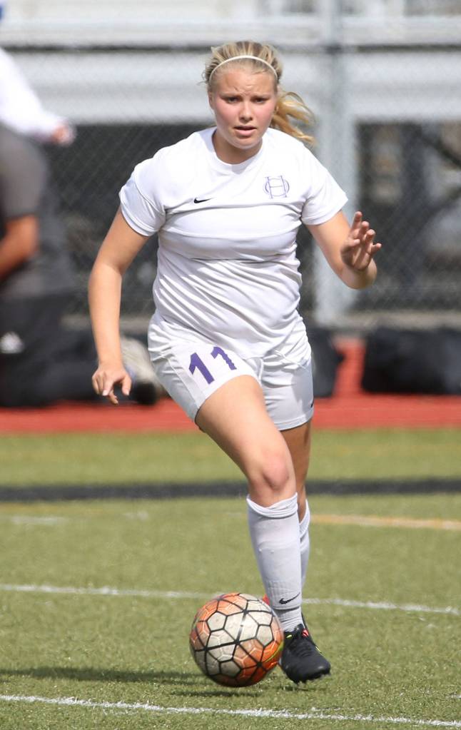 Caylie Etherington, who scored one of the Wildcats&rsquo; two goals in the match, advances the ball for Oak Harbor. (Photo by John Fisken)