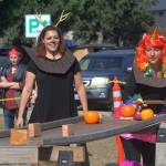 Windermere team member Sarah Erbe, right, tries to sink a pumpkin while team mate Cheryl Lueder cheers on. Photo by Megan Hansen/Whidbey News-Times