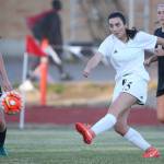 Kalia Littlejohn blasts the ball past Klahowya&rsquo;s Hope Martin (7). (Photo by John Fisken)