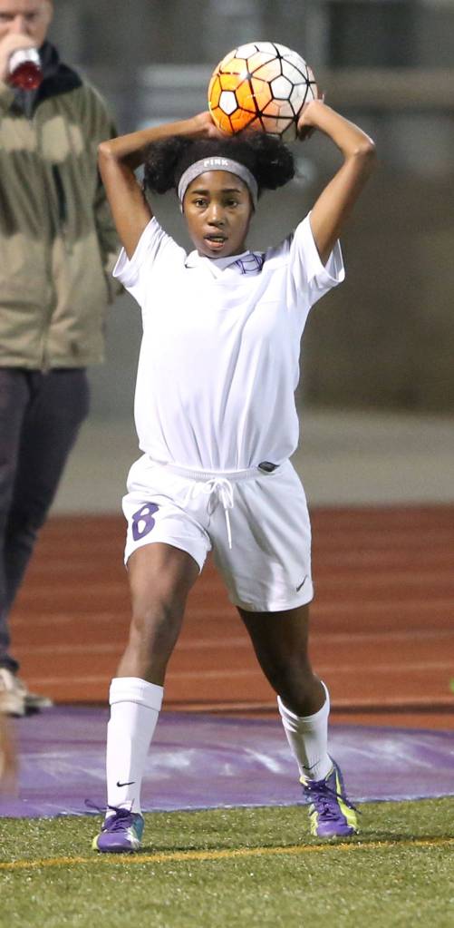 Jessica Vester inbounds the ball for the Wildcats. (Photo by John Fisken)