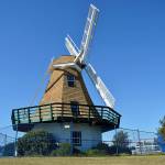 The iconic windmill at Windjammer park currently has a fence around it to protect the public from debris potentially falling off of the aging structure. The city council is in the process of determining what to do with it before the windstorms of winter increase the risk. Photo by Laura Guido/Whidbey News-Times