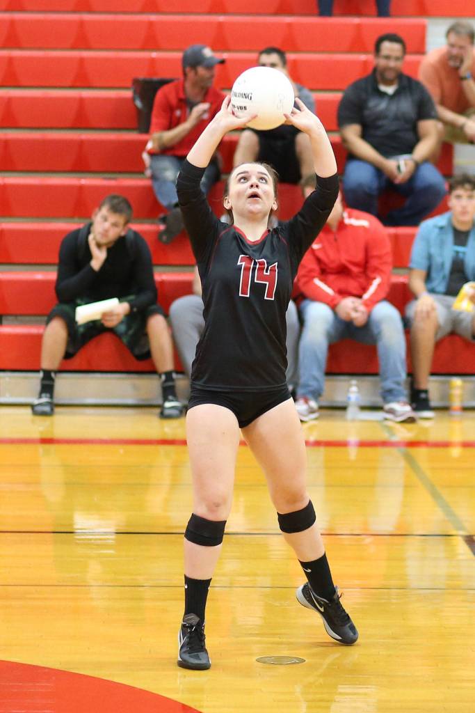 Ashley Menges delivers one of her eight assists in the match. (Photo by John Fisken)
