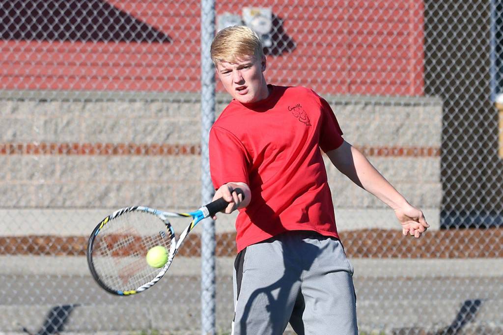 Jaschon Baumann volleys for the Wolves Wednesday. (Photo by John Fisken)