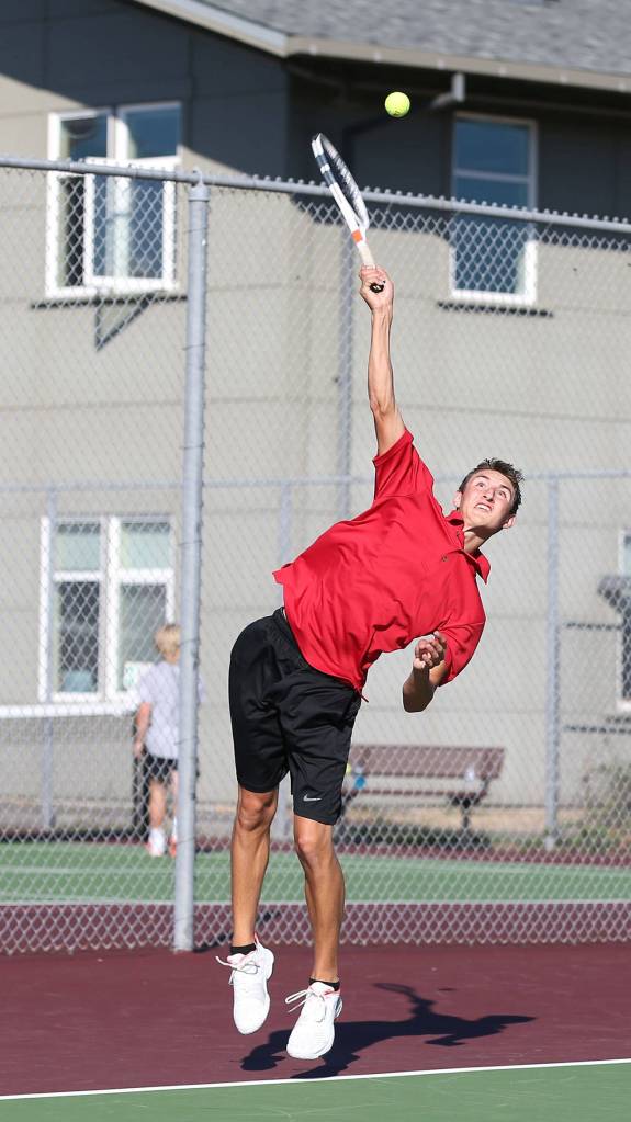 Joey Lippo rockets a serve for Coupeville. (Photo by John Fisken)