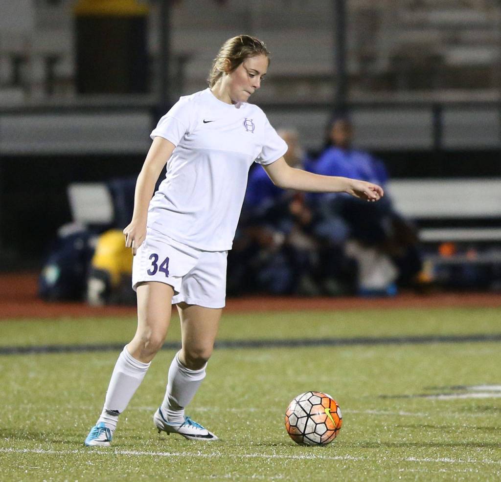 Chloe Wallace prepares to pass for Oak Harbor.(Photo by John Fisken)