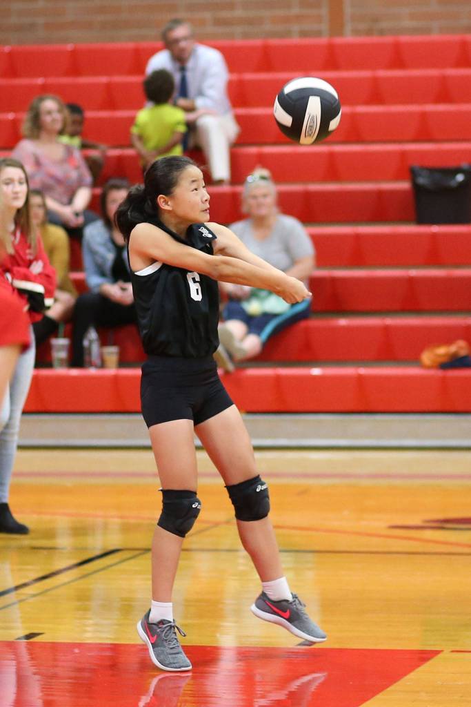 Coupeville&rsquo;s Jaelyn Crebbin pops a pass in the eighth-grade match.(Photo by John Fisken)