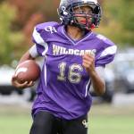 Oak Harbor Junior Ezra Kitchens looks for running room.(Photo by John Fisken)