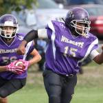 Kanye Kitchens (15) leads the blockers for Mateo Toledo (56) in the Senior game.(Photo by John Fisken)