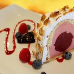 This Baked Alaska is a many-layered wonder of sponge cake, rhubarb sherbet, blueberry sorbet center, toasted meringue and swirls of raspberry.