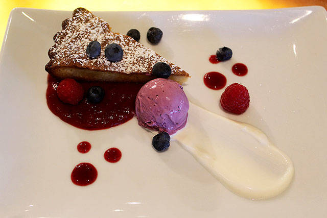 Almond cake, featuring blueberry ice cream and strawberry jam.