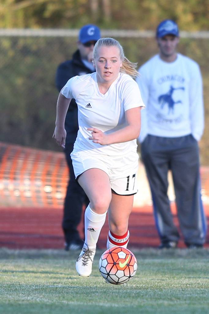 Sage Renninger pushes the ball up the field for the Wolves.(Photo by John Fisken)