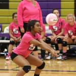 Jaslin Webster passes as coach Kerri Molitor and the Wildcat bench looks on.(Photo by John Fisken)